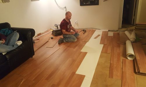 man-working-hardwood-floor-home.jpg